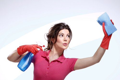 Local oven cleaner working in a Putney residential kitchen